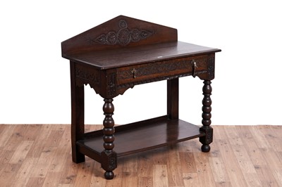 Lot 460 - An 19th Century carved oak side table
