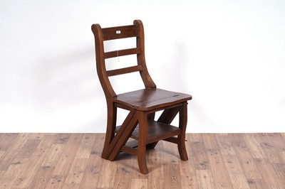 Lot 72 - A 20th Century stained hardwood metamorphic library chair