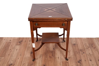 Lot 514 - An Edwardian inlaid mahogany and satinwood banded envelope card table