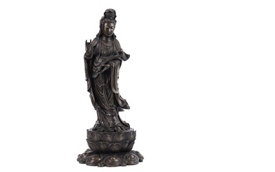 Lot 718 - A Chinese patinated bronze figure of Guanyin