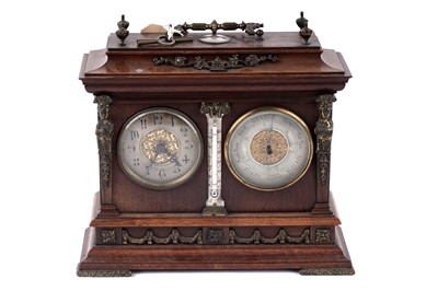 Lot 1230 - An Edwardian brass mounted mahogany desk clock barometer