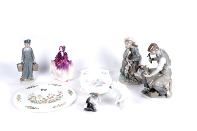 Lot 847 - A collection of Lladro and other figures; and two cake plates