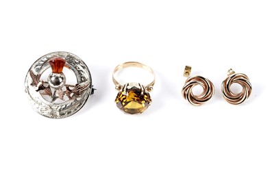 Lot 216 - A fancy orange sapphire cocktail ring; a pair of earrings; and a brooch