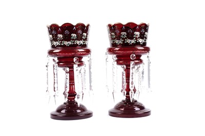 Lot 394 - A pair of Victorian cranberry glass table lustres
