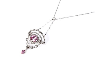 Lot 762 - An Edwardian pink topaz and diamond pendant brooch