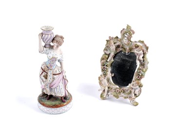 Lot 379 - A 19th Century bisque figural study of a female; and a porcelain mirror