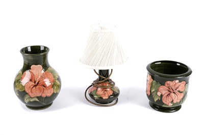 Lot 295 - A Moorcroft 'Hibiscus' pattern table lamp; and other 'Hibiscus' ceramics