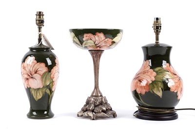 Lot 297 - Two Moorcroft 'Hibiscus' pattern table lamps; and a Moorcroft 'Hibiscus' pattern tazza