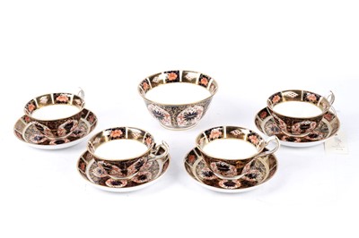Lot 347 - Four Royal Crown Derby 1128 ‘Imari’ pattern teacups and saucers; and a sugar bowl