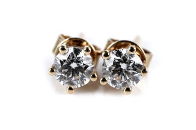 Lot 653 - A pair of diamond stud earrings