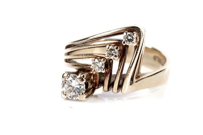 Lot 650 - A four stone diamond dress ring