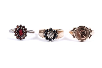 Lot 85 - A Mexican gold coin ring; and two cluster dress rings