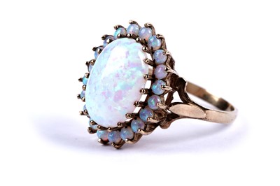 Lot 82 - A synthetic opal cluster dress ring