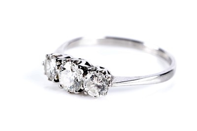 Lot 641 - A three stone diamond ring