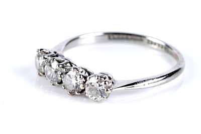 Lot 642 - A four stone diamond ring
