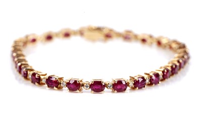 Lot 645 - A ruby and diamond bracelet