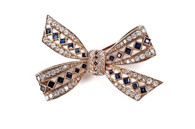 Lot 647 - A sapphire and diamond bow pattern brooch