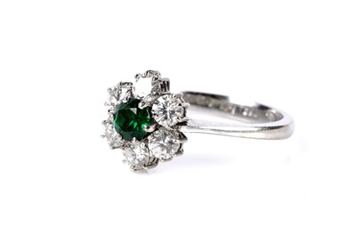 Lot 654 - A grossular garnet and diamond cluster ring