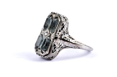 Lot 69 - An aquamarine and diamond swivel dress ring