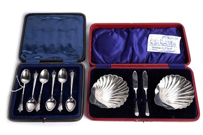 Lot 317 - A pair of Edwardian silver butter dishes; and a set of Victorian teaspoons