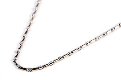 Lot 657 - A 9ct yellow and white gold diamond necklace
