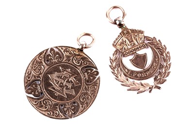 Lot 8 - An Edwardian 9ct rose gold fob medal; and another