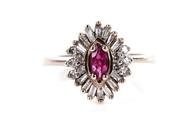 Lot 660 - A ruby and diamond cluster ring