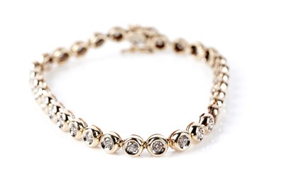 Lot 662 - A diamond tennis bracelet