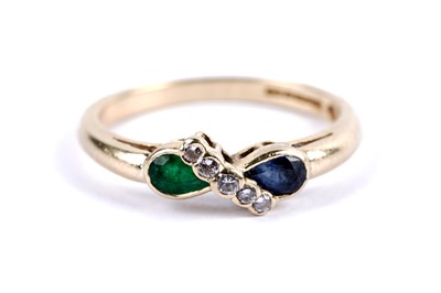 Lot 15 - An emerald, sapphire and diamond dress ring