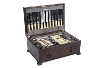 Lot 926 - An early 20th Century oak canteen containing silver plated cutlery
