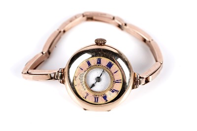 Lot 265 - An early 20th Century gold cased half hunter lady's wristwatch