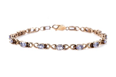 Lot 128 - A tanzanite tennis bracelet