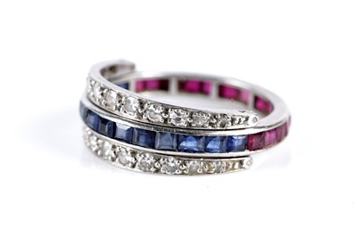 Lot 630 - A sapphire, ruby and diamond day to night eternity ring