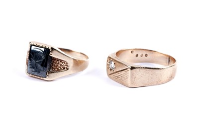 Lot 20 - A hematite intaglio gold signet ring; and a star set diamond signet ring