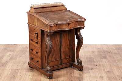 Lot 428 - A Victorian walnut serpentine fronted davenport