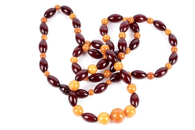 Lot 784 - A red and butterscotch amber necklace