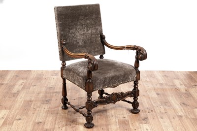 Lot 415 - An early 20th Century carved oak armchair