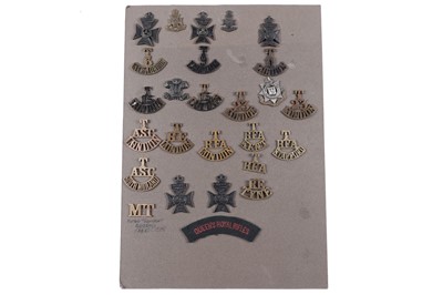 Lot 49 - A display of British Military Territorial title badges