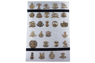 Lot 57 - A display of mostly First World War period British military cap badges