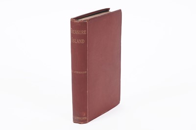 Lot 317 - Stevenson (Robert Louis) ‘Treasure Island’, first edition, map frontispiece