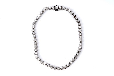 Lot 786 - A diamond tennis bracelet