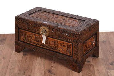 Lot 483 - An Oriental carved camphor wood blanket box