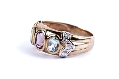 Lot 97 - A topaz, amethyst, peridot and diamond dress ring