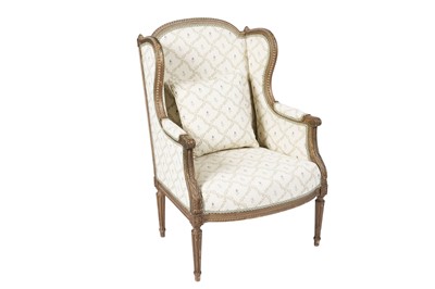 Lot 1284 - A French Louis XVI style giltwood framed wingback armchair