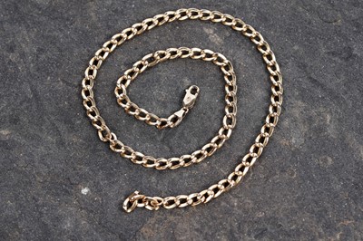 Lot 653 - A yellow gold rounded curb link chain necklace