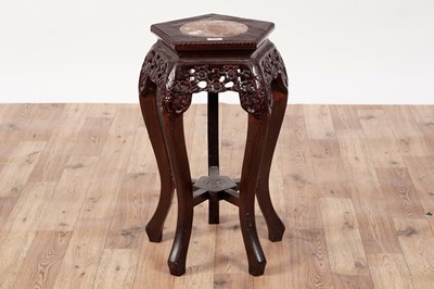 Lot 410 - An early 20th Century Chinese carved hardwood jardinière stand