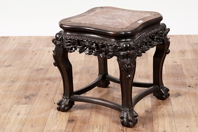 Lot 409 - An early 20th Century Chinese carved hardwood jardinière stand