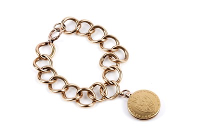 Lot 674 - An 18ct yellow gold bracelet with guinea locket