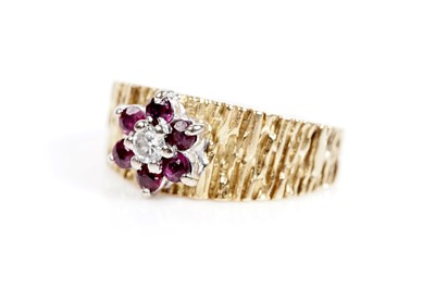 Lot 618 - A ruby and diamond flower cluster ring