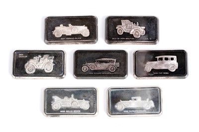 Lot 819 - A set of seven John Pinches car pattern silver ingots